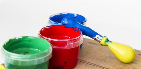 Image showing green, red andblue paint with brush