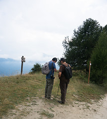 Image showing Tourists looking to a map