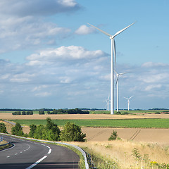 Image showing Wind generator turbine on summer landscape