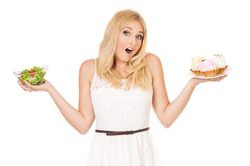 Image showing Woman with vegetables and cake