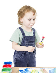 Image showing cute girl painting. isolated on white background