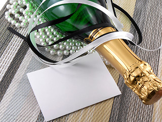 Image showing champagne bottle with christmas present, holiday invitation card