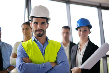 Image showing business people and construction engineers on meeting