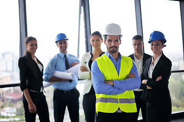 Image showing business people and construction engineers on meeting