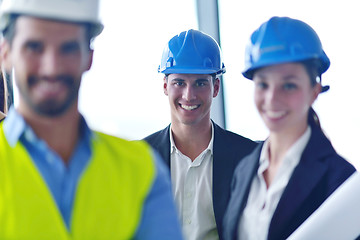 Image showing business people and construction engineers on meeting