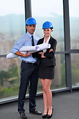 Image showing business people and construction engineers on meeting