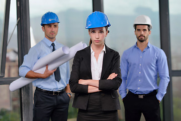 Image showing business people and construction engineers on meeting