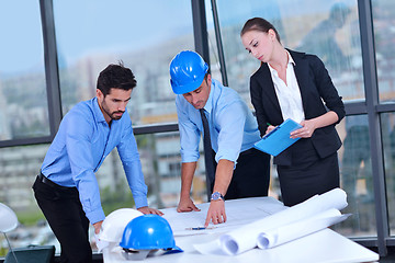 Image showing business people and construction engineers on meeting