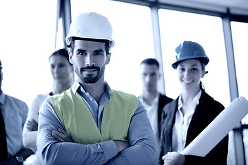 Image showing business people and construction engineers on meeting