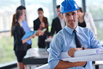 Image showing business people and construction engineers on meeting