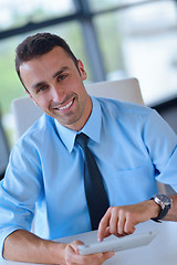 Image showing business man using tablet compuer at office