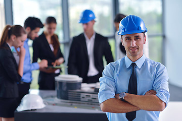 Image showing business people and construction engineers on meeting