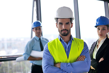 Image showing business people and construction engineers on meeting