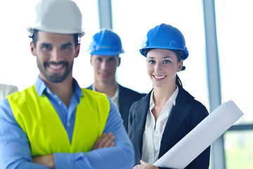 Image showing business people and construction engineers on meeting