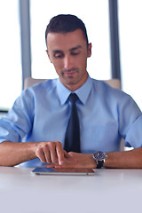 Image showing business man using tablet compuer at office