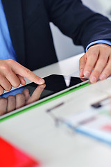 Image showing business man using tablet compuer at office