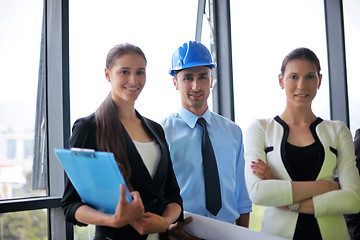 Image showing business people and construction engineers on meeting