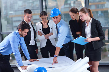 Image showing business people and construction engineers on meeting