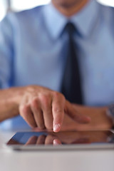 Image showing business man using tablet compuer at office