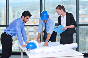 Image showing business people and construction engineers on meeting