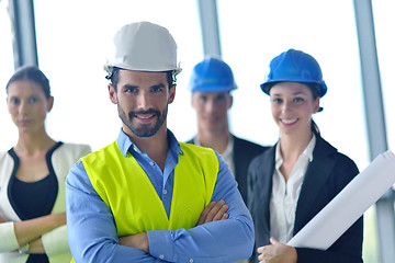 Image showing business people and construction engineers on meeting