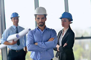 Image showing business people and construction engineers on meeting