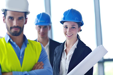 Image showing business people and construction engineers on meeting