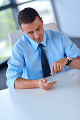 Image showing business man using tablet compuer at office