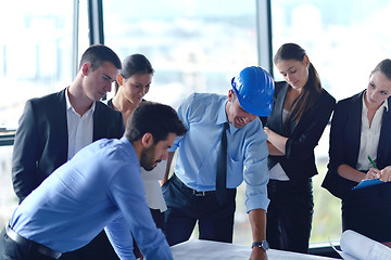 Image showing business people and construction engineers on meeting