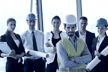 Image showing business people and construction engineers on meeting