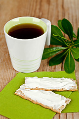 Image showing cup of tea and crackers with cream cheese 