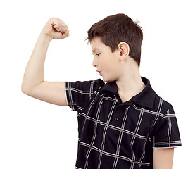 Image showing Portrait of a young boy with hand raised up and showing muscles