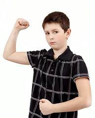 Image showing Portrait of a young boy with hand raised up and showing muscles