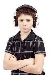 Image showing Portrait of a young boy listening to music on head