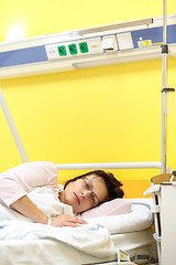 Image showing sad middle-aged woman lying in hospital