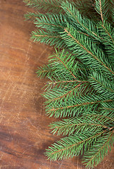 Image showing frame from branch of Christmas tree on old wood