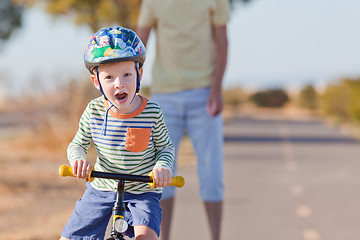 Image showing little boy biking