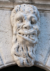 Image showing ugly man bas-relief stone face