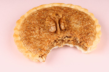 Image showing Bitten mini walnut tart