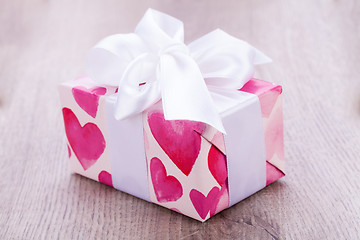 Image showing Pretty Valentines gift with hearts on the giftwrap