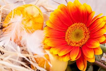 Image showing Vivid orange Easter egg with a gerbera and rose