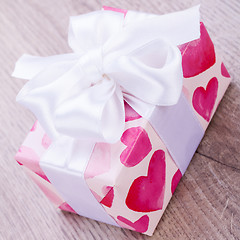 Image showing Pretty Valentines gift with hearts on the giftwrap