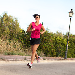 Image showing Caucasian woman practicing jogging in the park