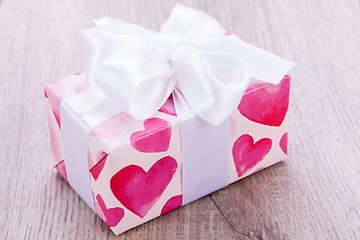 Image showing Pretty Valentines gift with hearts on the giftwrap