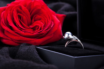 Image showing red rose and diamond ring in a box 