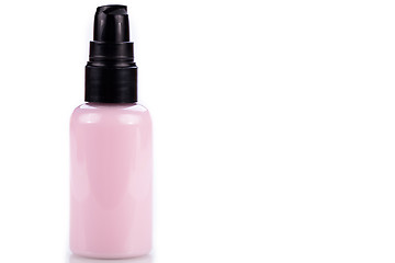 Image showing pink plastic bottle of cosmetic cream isolated on white