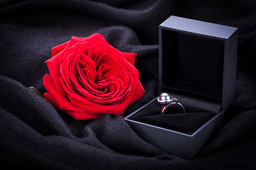 Image showing red rose and diamond ring in a box 