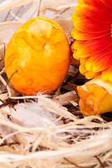 Image showing Vivid orange Easter egg with a gerbera and rose