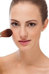 Image showing apllying powder make up on face portrait