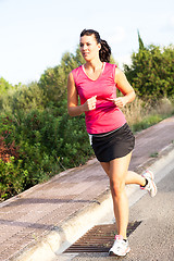 Image showing Caucasian woman practicing jogging in the park